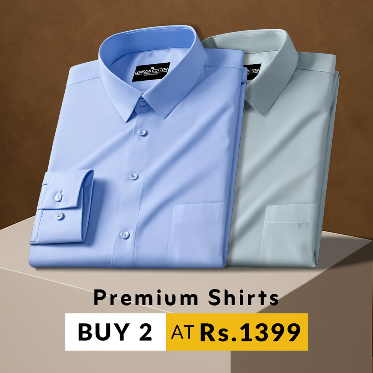 Two folded premium shirts, one blue and one gray, on a brown background with promotional text.