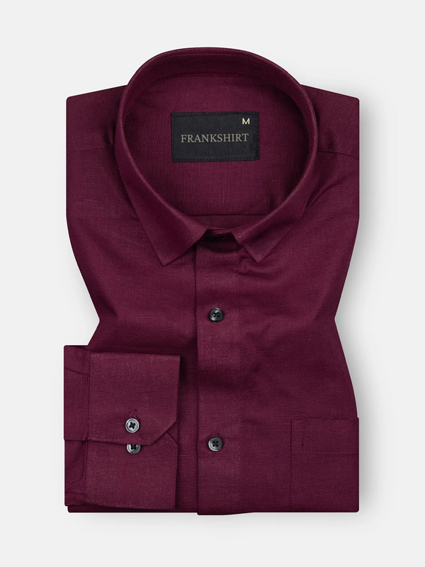 A maroon colored, long-sleeved, button-down linen shirt by Frankish.