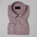 Folded checkered shirt with brand label on a gray background