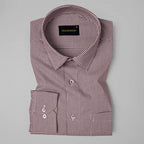 Folded checkered shirt with brand label on a gray background