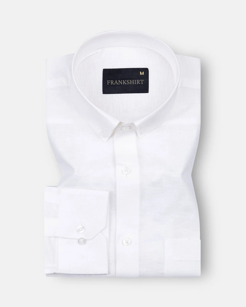 A white, long-sleeved, button-down linen shirt by Frankshirt laid out flat on a plain background.