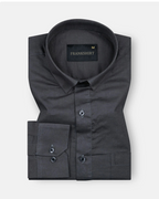 A black, long-sleeved, button-down men's linen shirt with a spread collar, displayed against a white background.