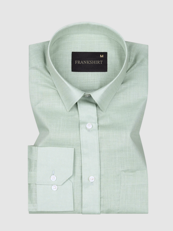 A pista green, long-sleeved, button-down linen shirt by Frankshirt displayed against a white background.