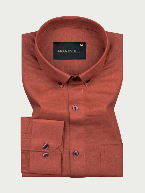 A brown, long-sleeved, button-down linen shirt by Frankshirt laid out flat on a white background.