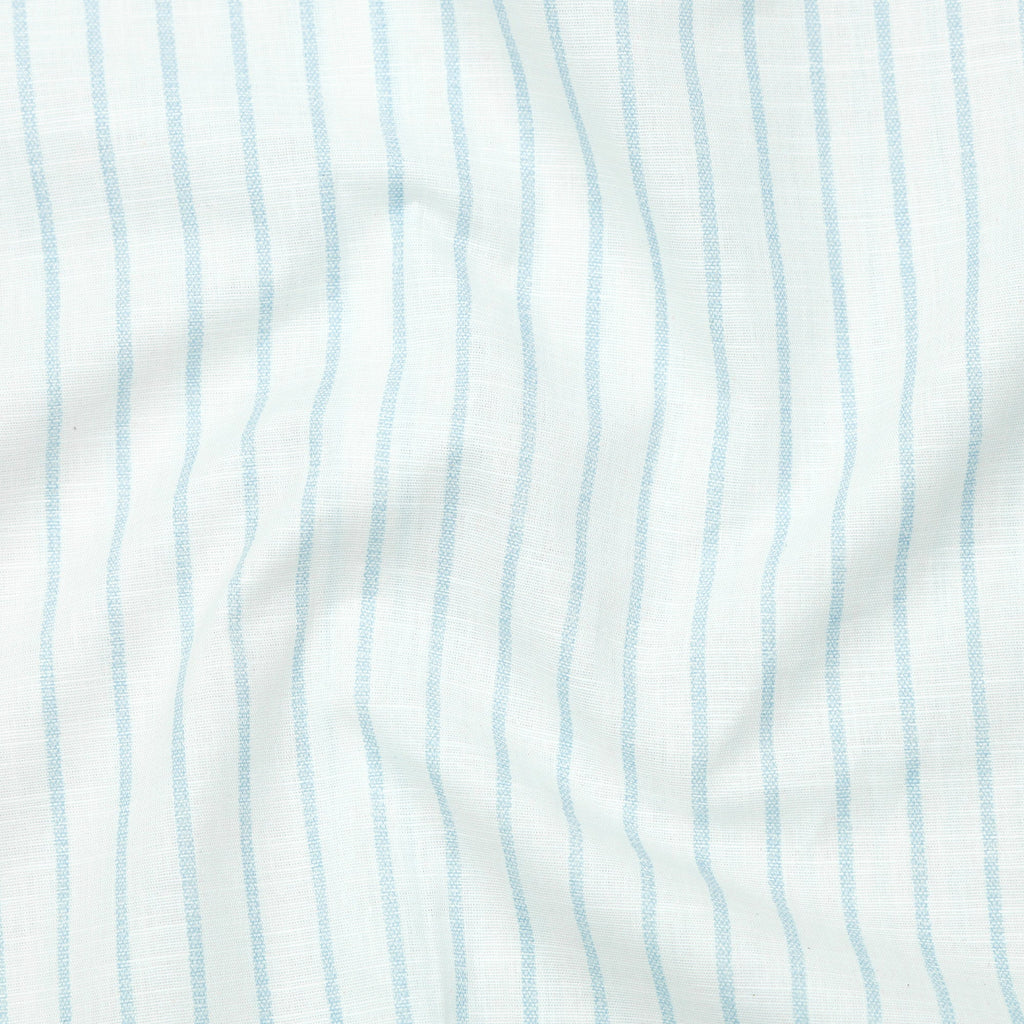 Close-up of fabric with light blue vertical stripes on a white background