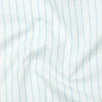Close-up of fabric with light blue vertical stripes on a white background