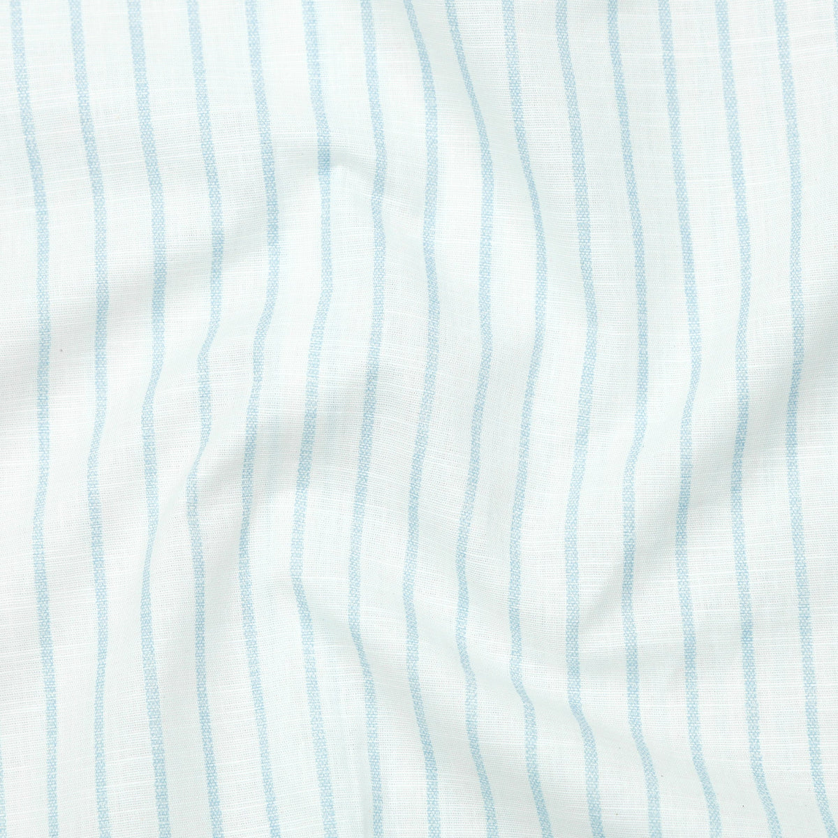 Close-up of fabric with light blue vertical stripes on a white background