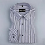 Folded black and white striped shirt with 'London Cotton' label on a gray background