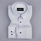 Folded white shirt with blue stripes on a gray background