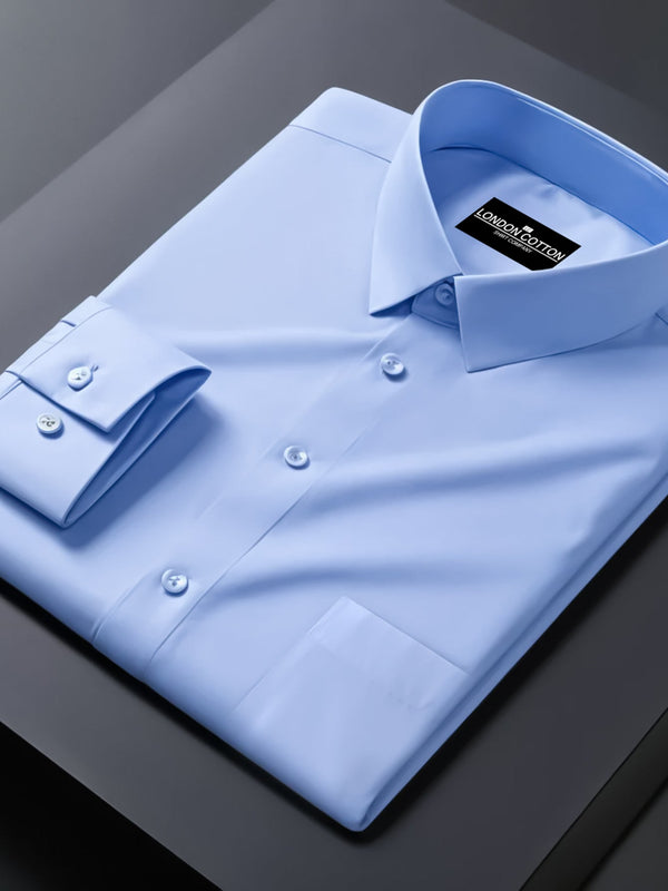 Light blue dress shirt with a brand label on a dark surface
