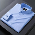 Light blue dress shirt with a brand label on a dark surface