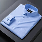 Light blue dress shirt with a brand label on a dark surface
